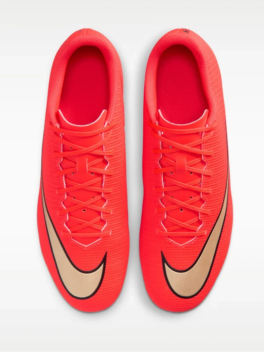 Nike Women’s Red Soccer Cleats with Gold Swoosh Accent